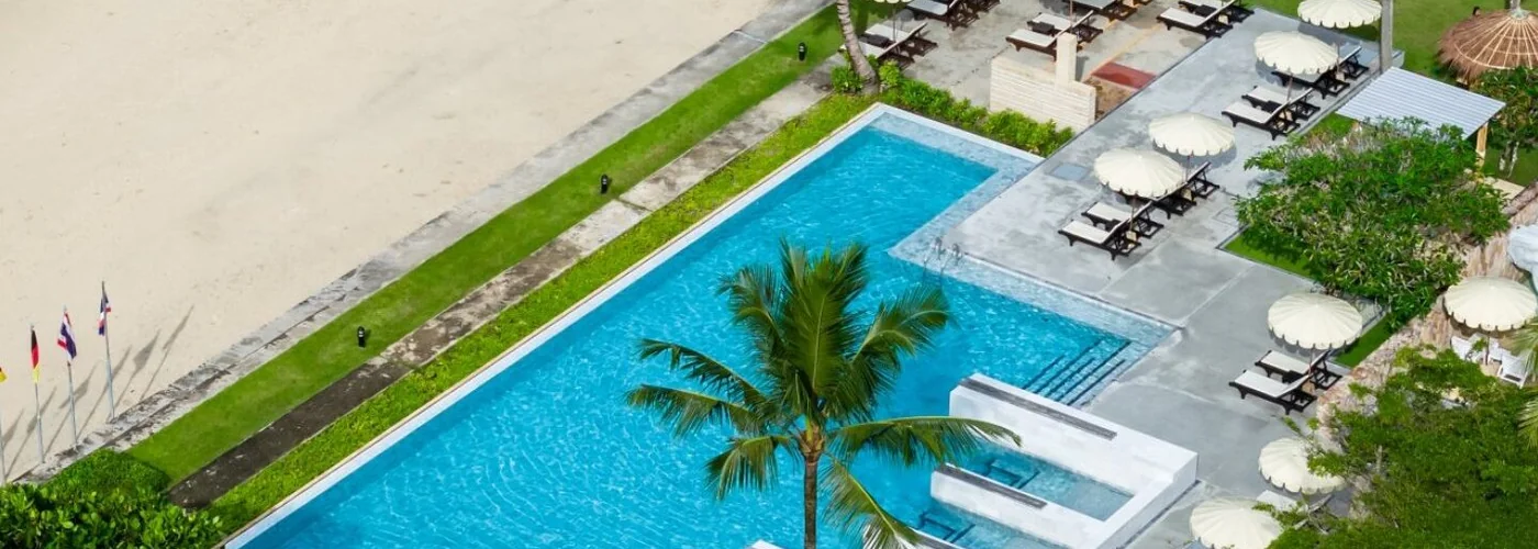 Infinity pool and beachfront setting at Apsara Beachfront Resort & Villa
