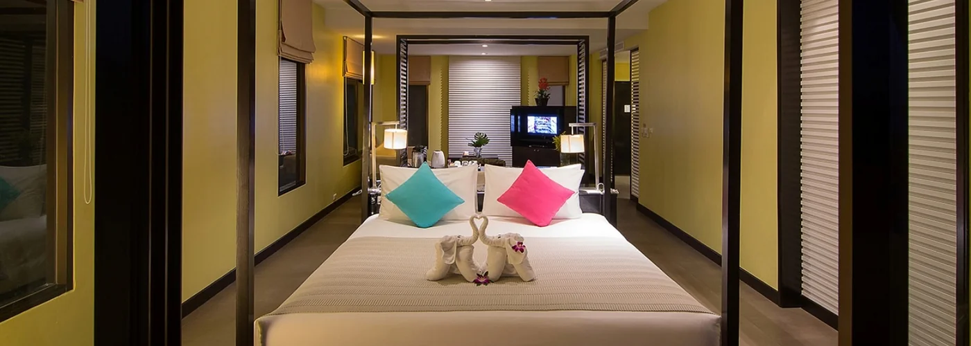 Apsara Suite bedroom with the living area visible beyond