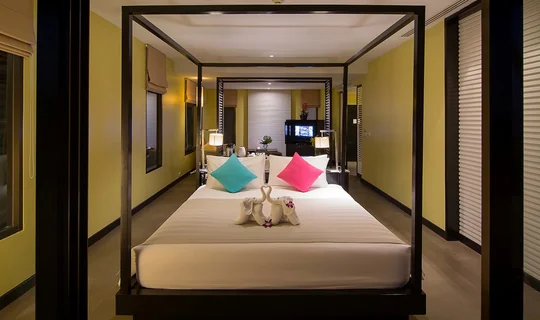 Apsara Suite bedroom with the living area visible beyond